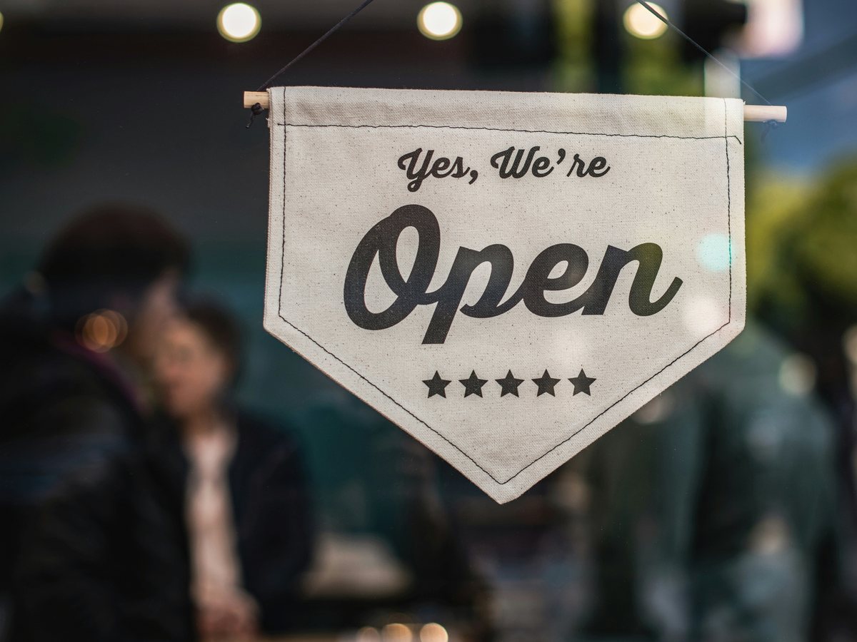 Open sign in a small business window